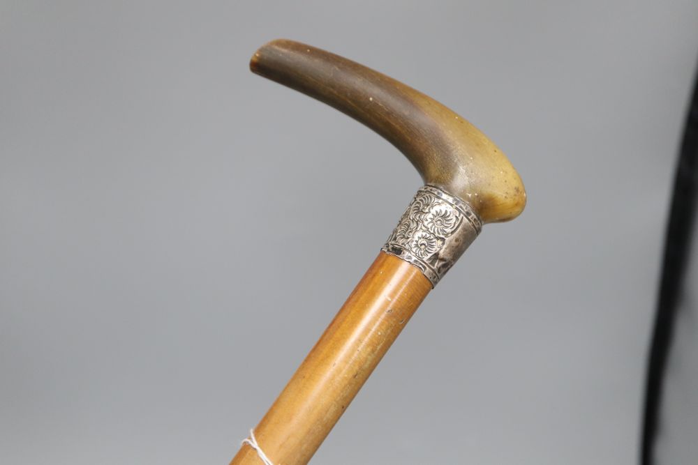 A Chinese horn and silver stick, possibly rhino horn